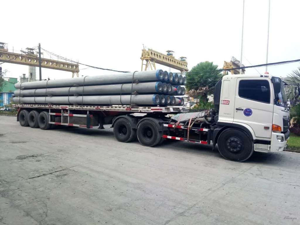Pengiriman Tiang Spun Pile Menggunakan Truck Trailer
